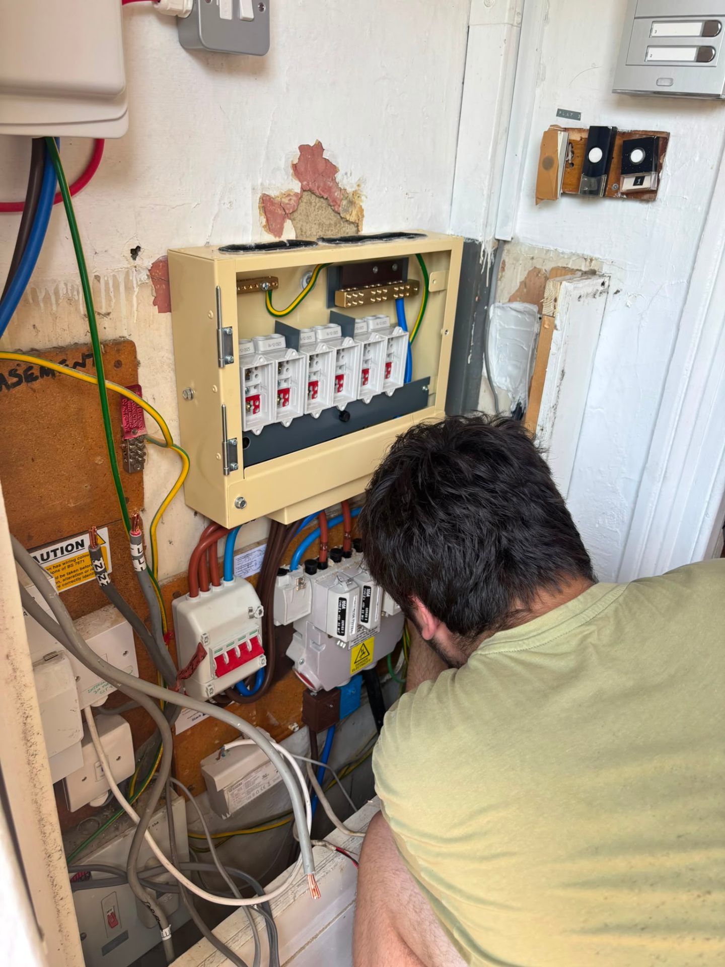 New 6-way switch fuse board being installed in a block of flats