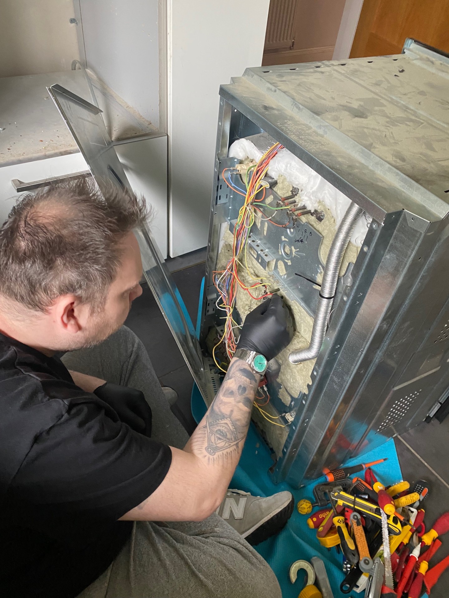 Appliance repair showing internal wiring diagnosis