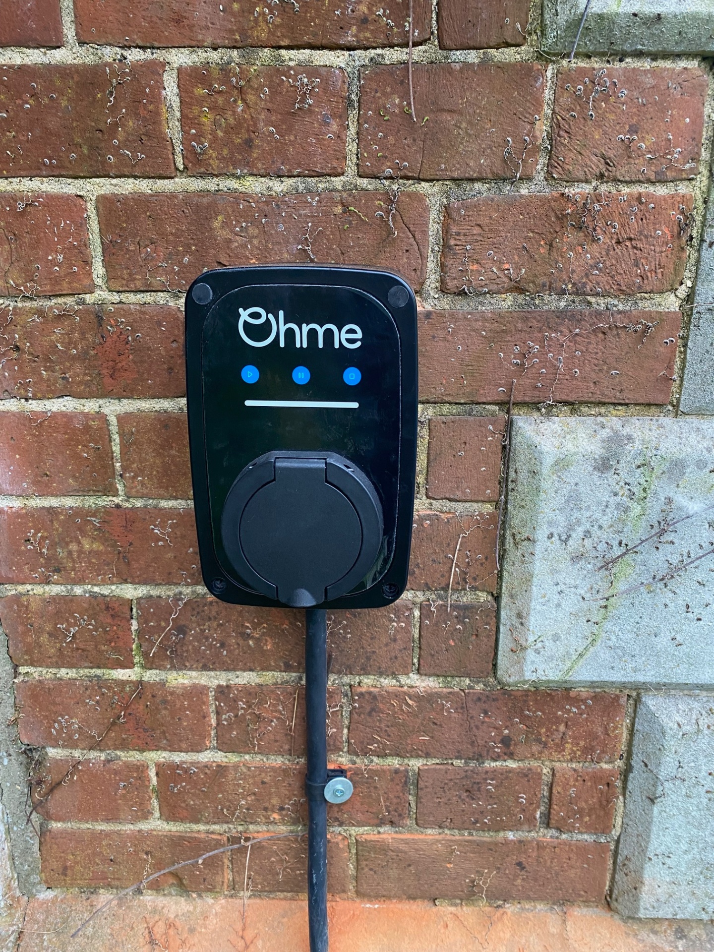 Close-up of Ohme home EV charger unit