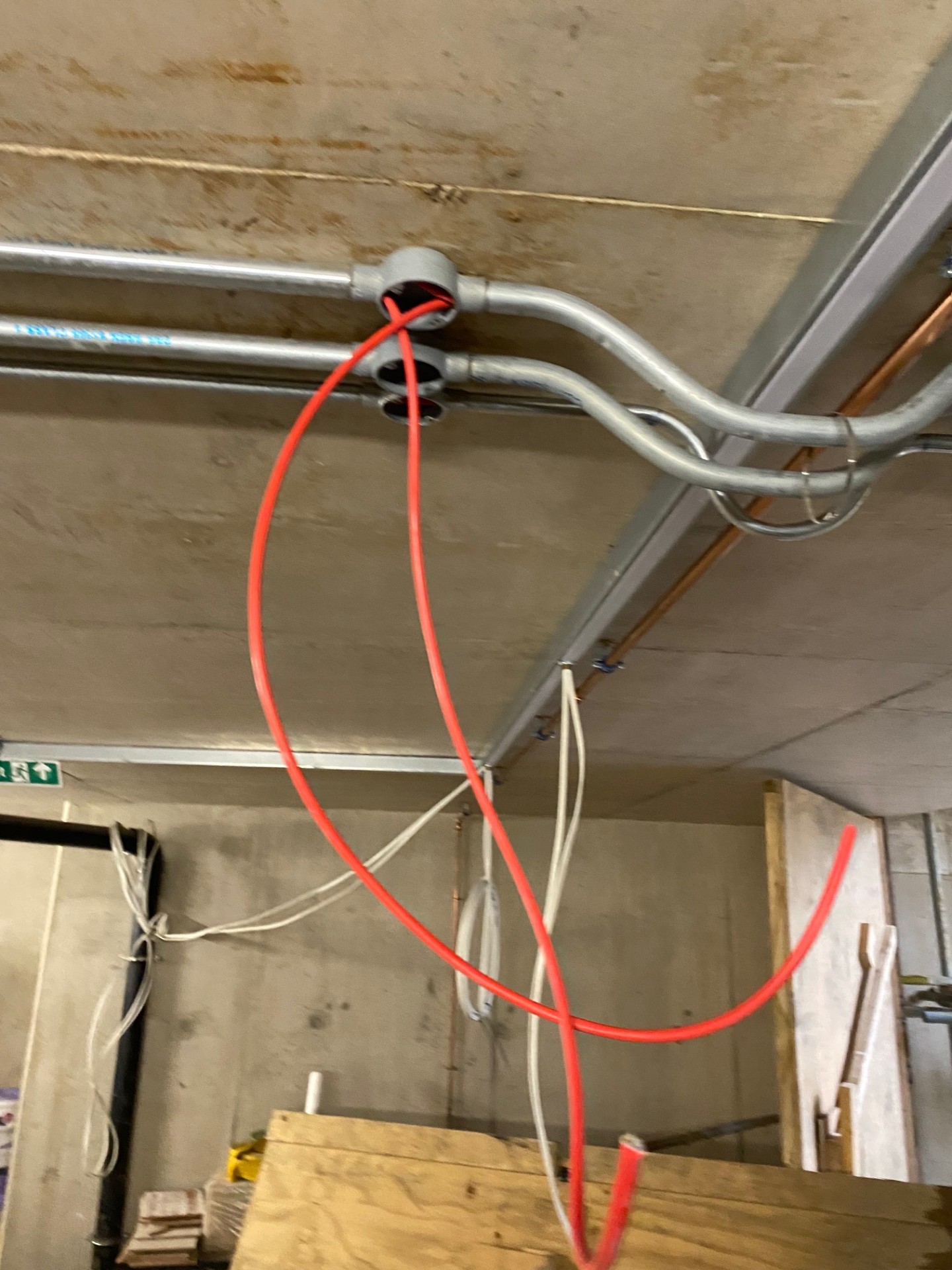 Red cable conduit installed for protected wiring route