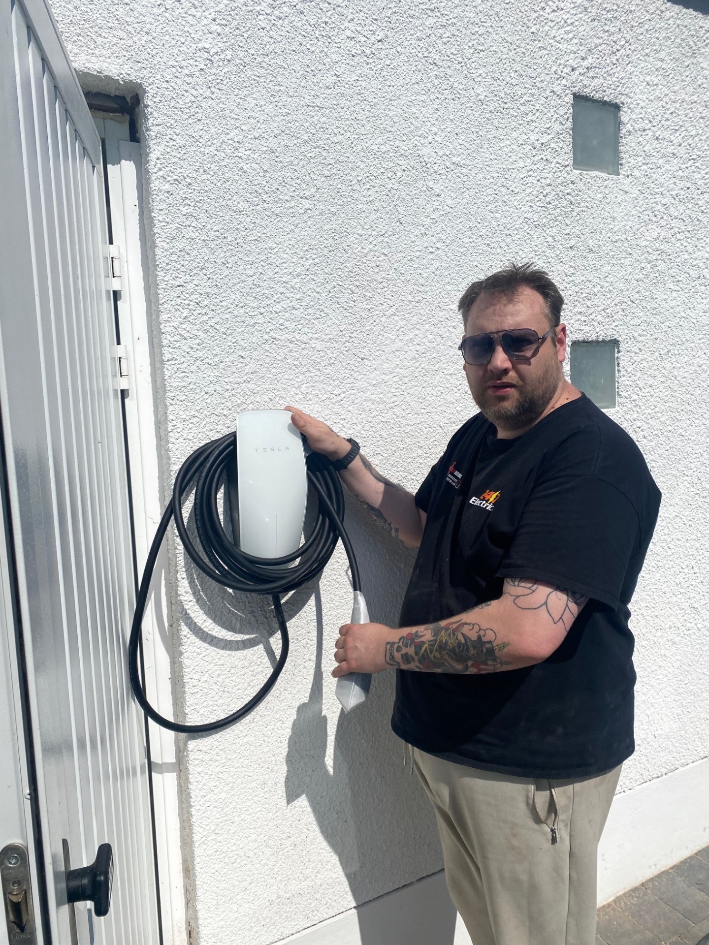 Tesla EV charger professionally installed at a residential property