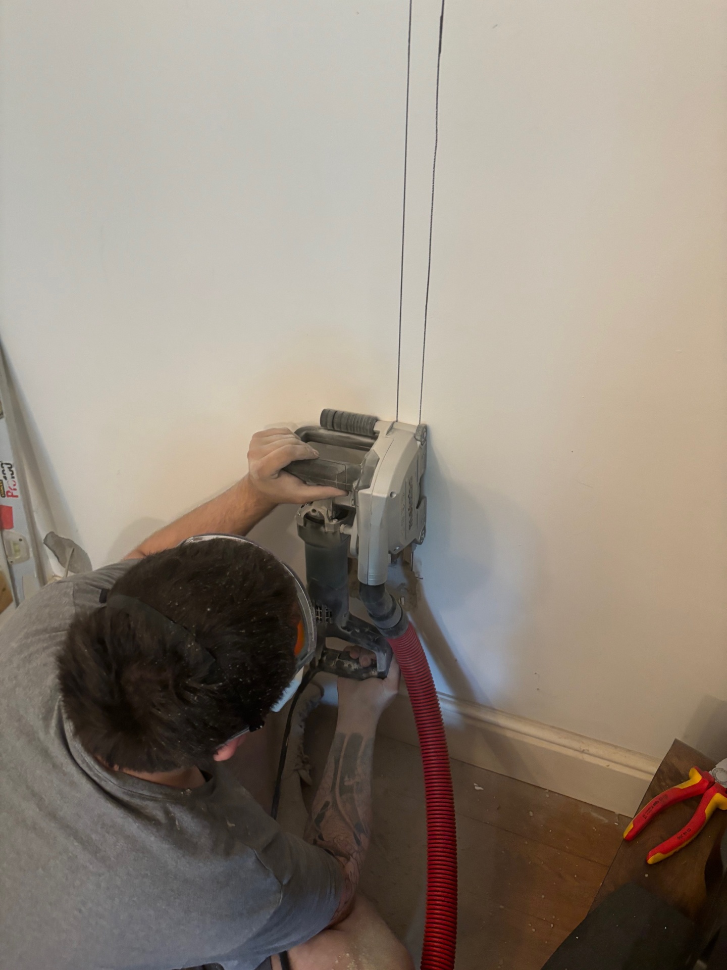 Wall chasing for rewiring in a London property