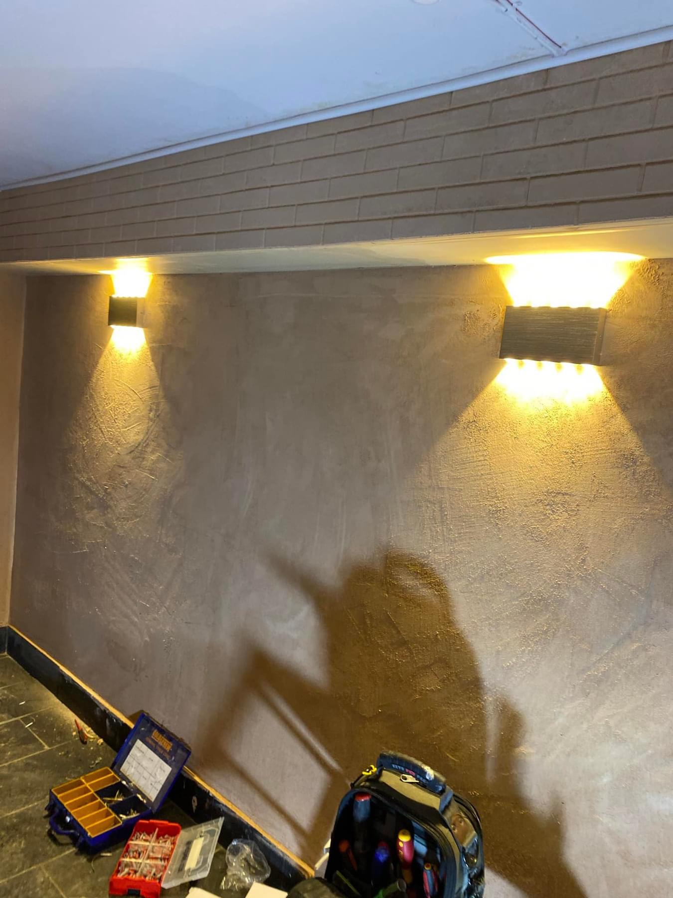 Wall-mounted lights professionally installed and finished